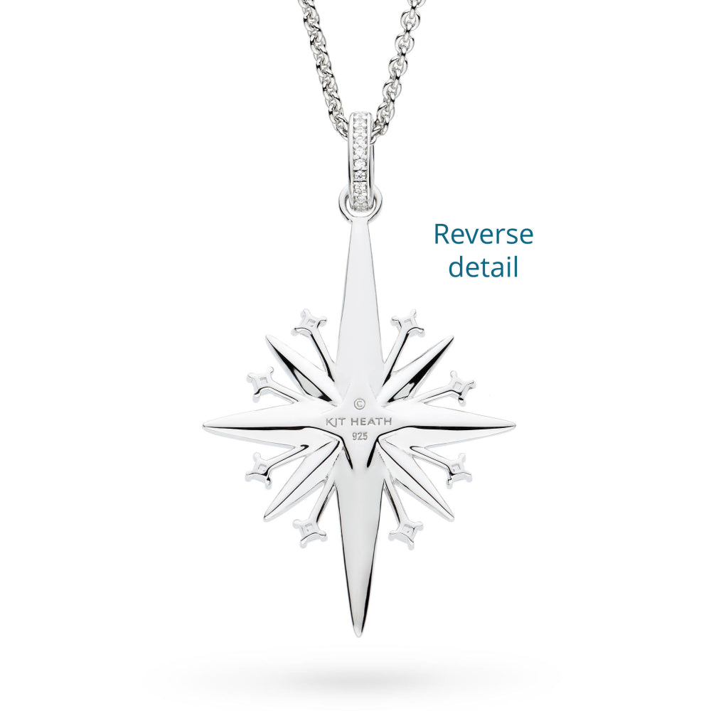 Silver pendant with star design on a white background