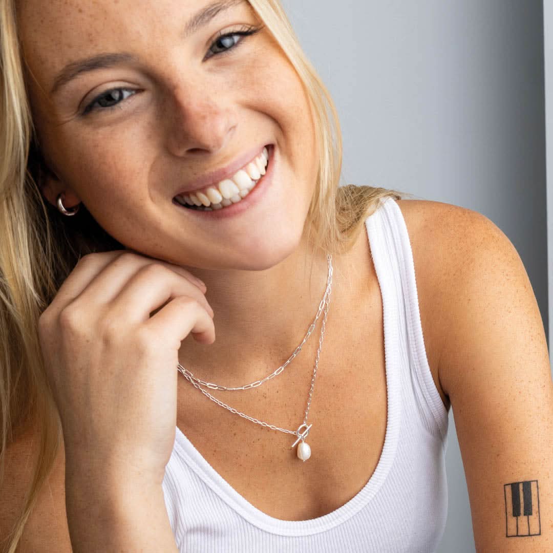 The Dew 10mm Freshwater Pearl T-Bar 18" Necklace 97737FP styled on a model, embodying sophisticated luxury and contemporary elegance.