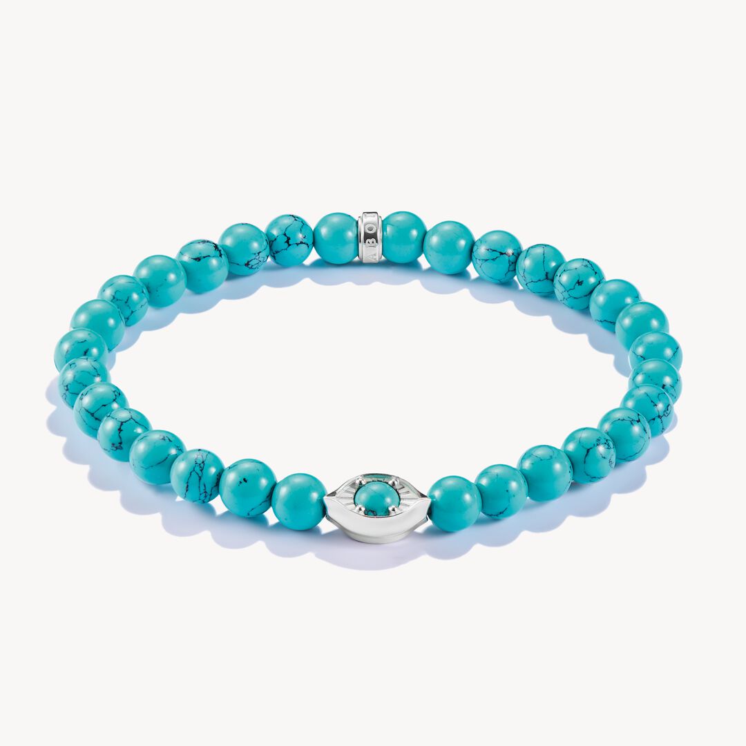 Turquoise beaded bracelet with silver clasp on a white background