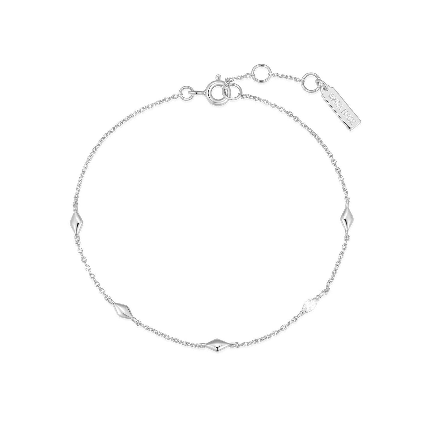 Silver bracelet with geometric links on a white background