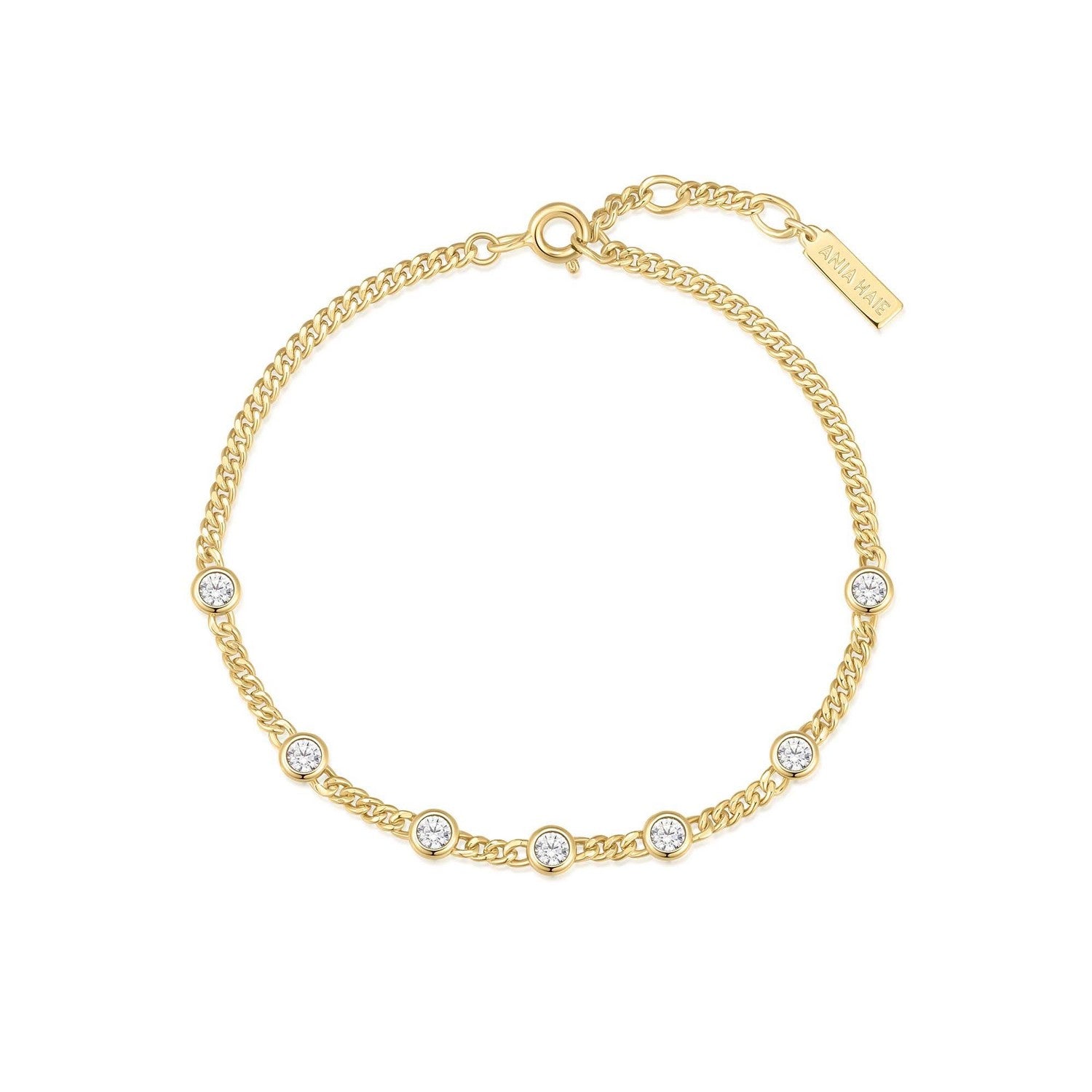 Gold bracelet with small crystals on a white background