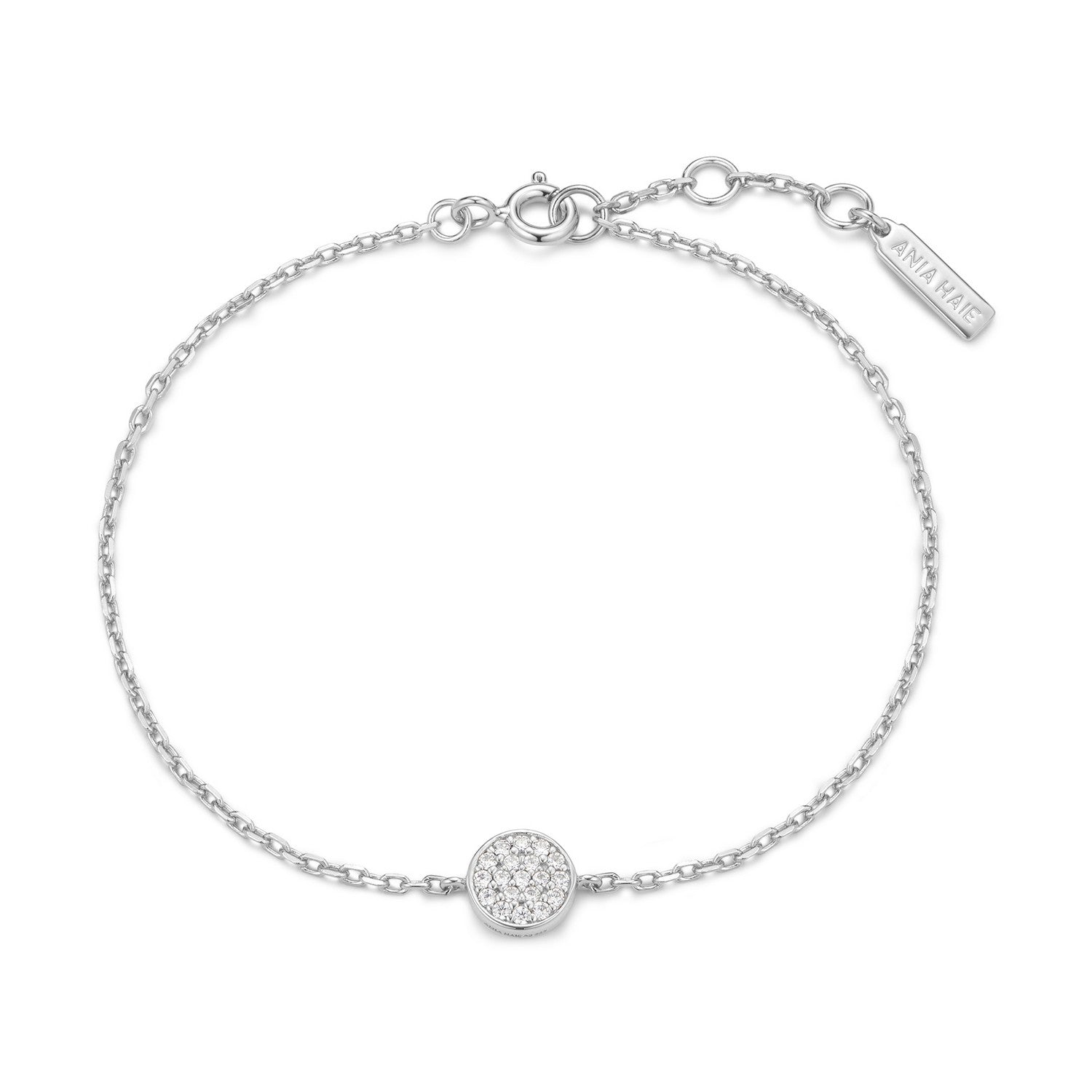 Silver bracelet with a round charm on a white background