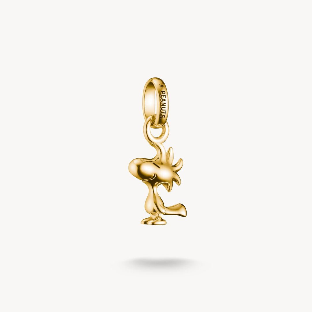 Gold moose pendant charm on a white background