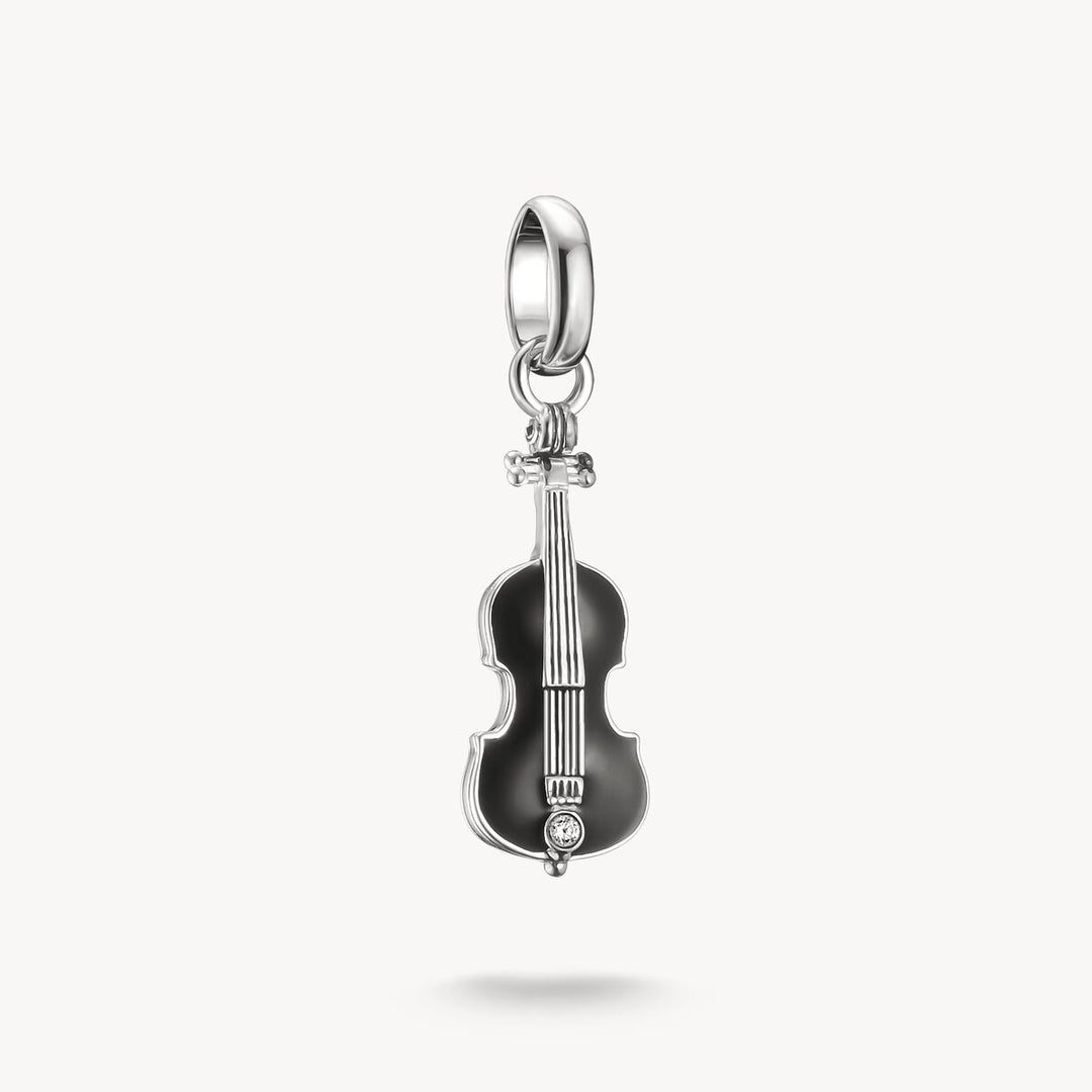 Violin-shaped pendant with a black body and silver details on a white background