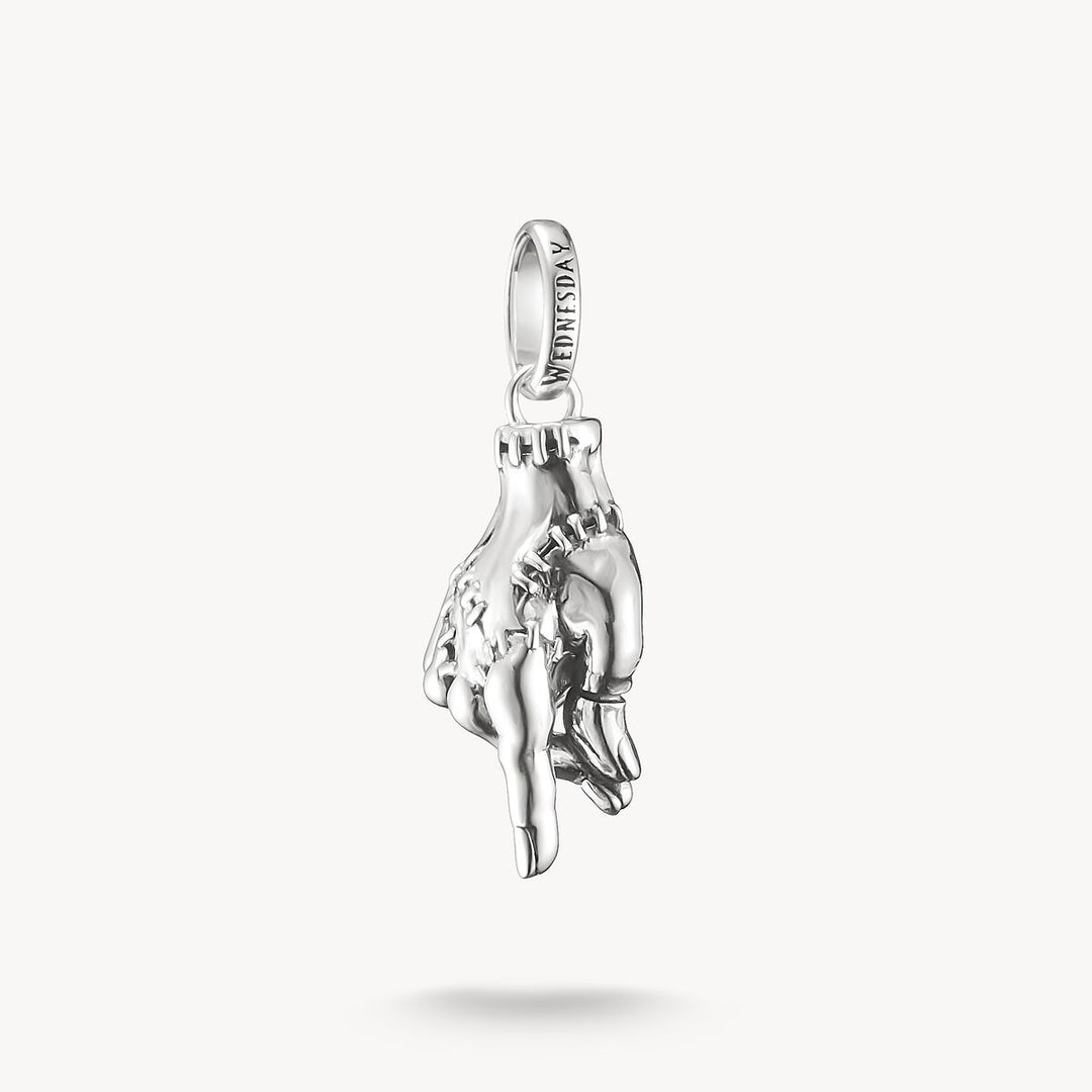 Silver pendant with a horse design on a white background