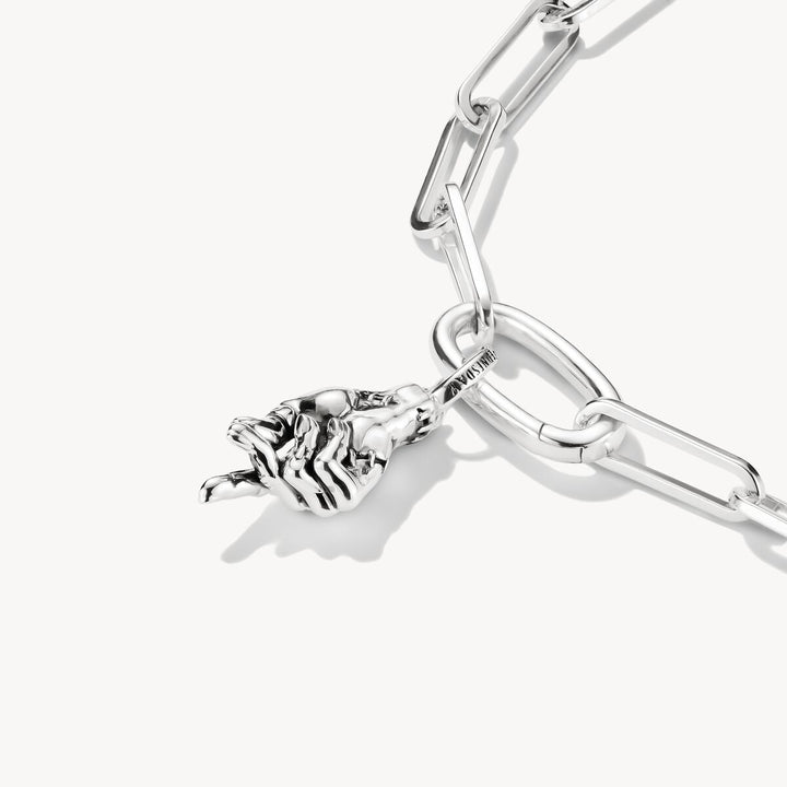 Silver bracelet with a rose charm on a white background
