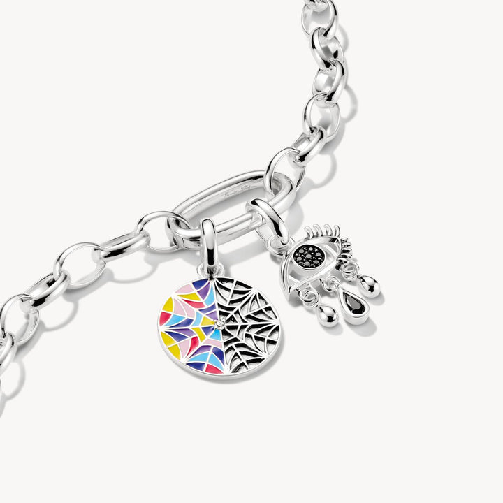 Silver bracelet with a colorful geometric charm on a white background