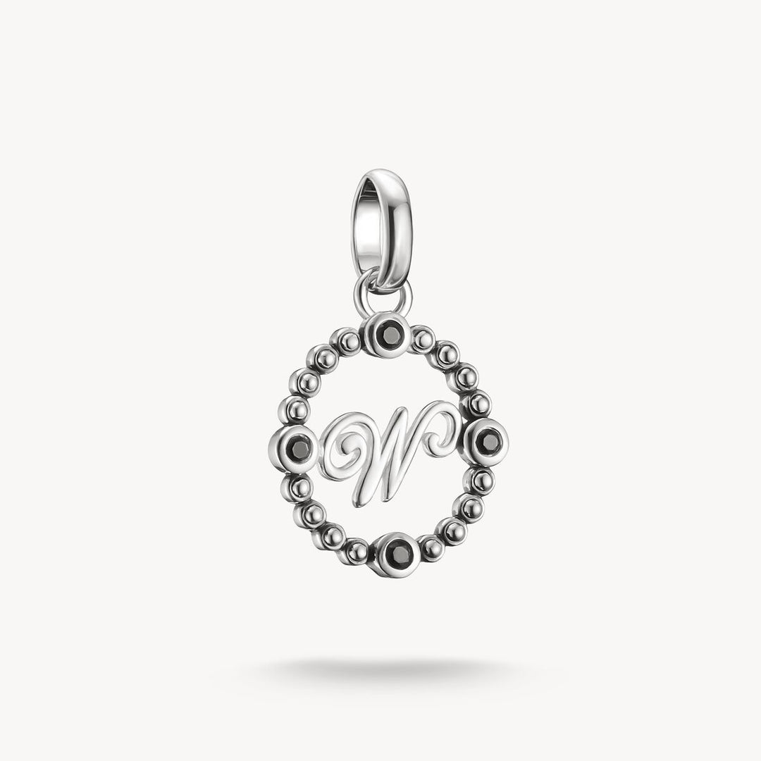 Silver pendant with letter 'W' on a white background
