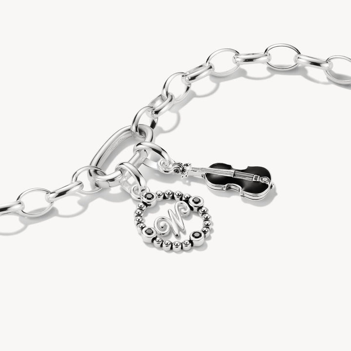 Silver bracelet with charms on a white background