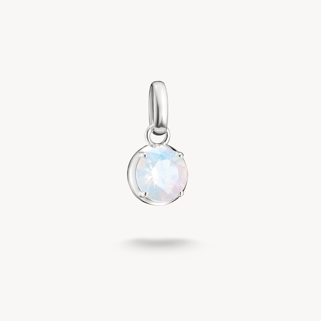 Silver pendant with a round, faceted gemstone on a white background
