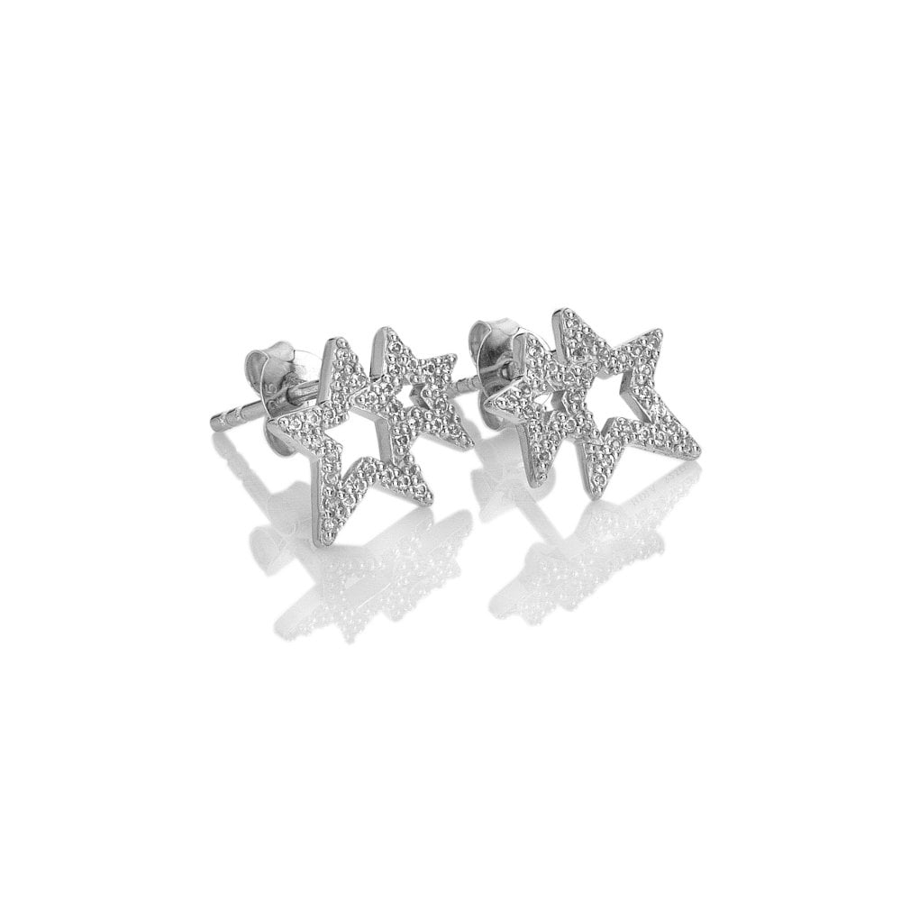 Star-shaped silver earrings with clear stones