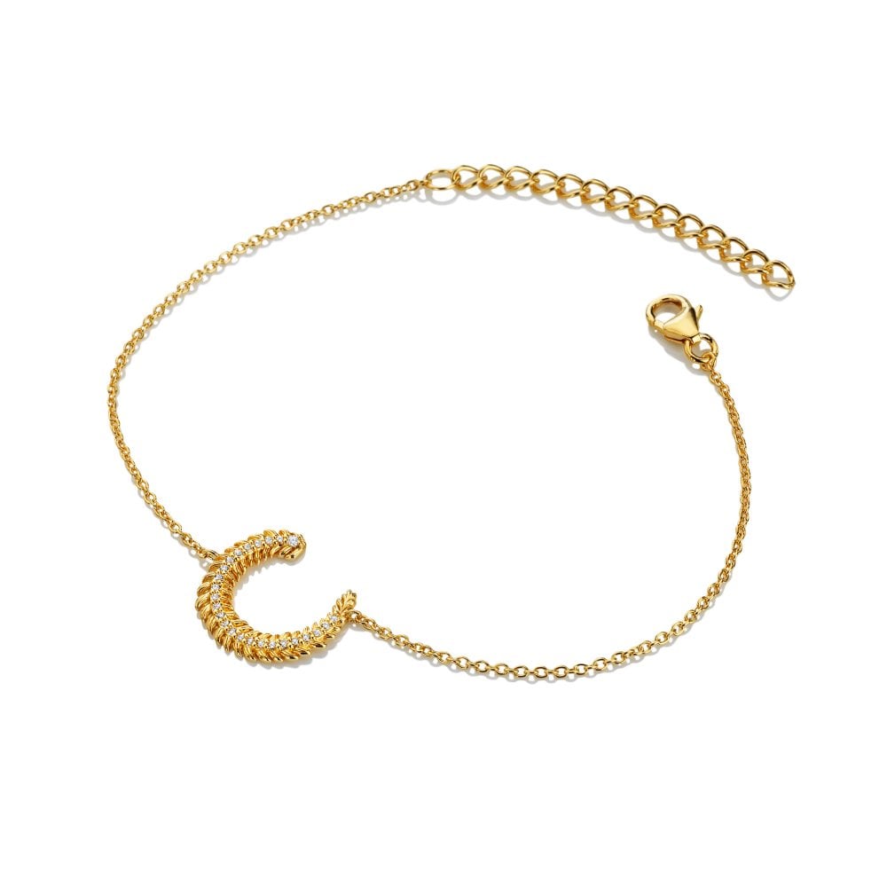 Gold bracelet with a crescent moon charm