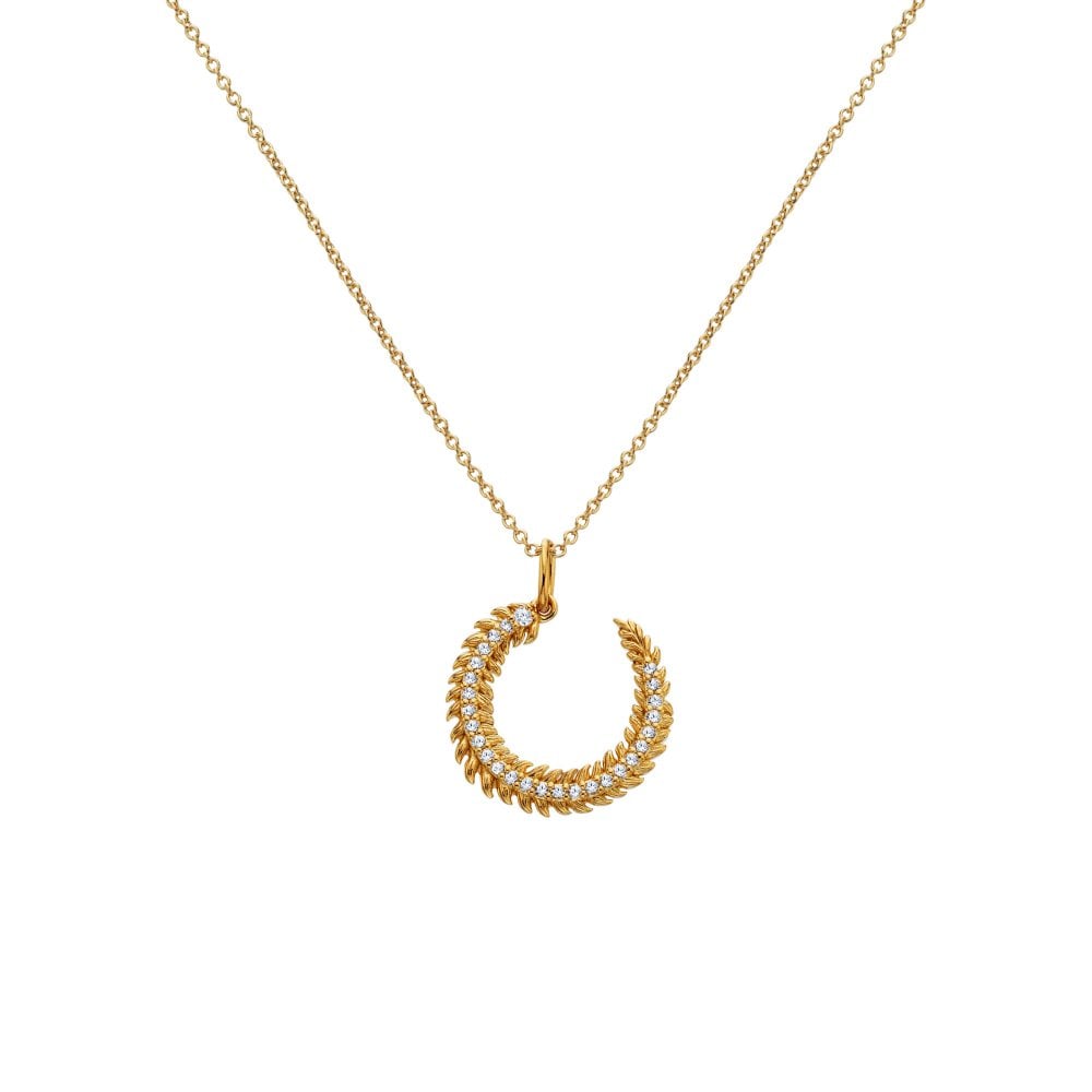 Gold necklace with a horse shoe-shaped pendant