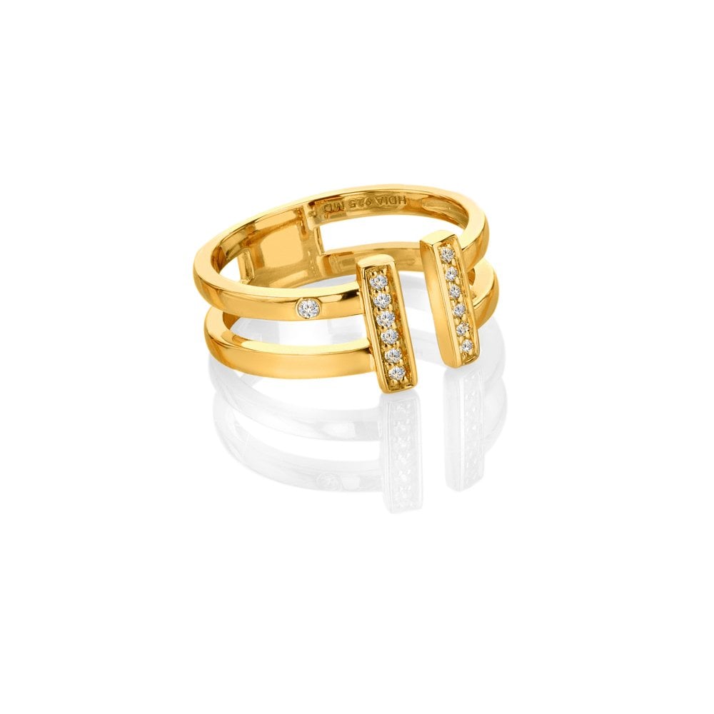 Gold ring with diamond accents on a white background