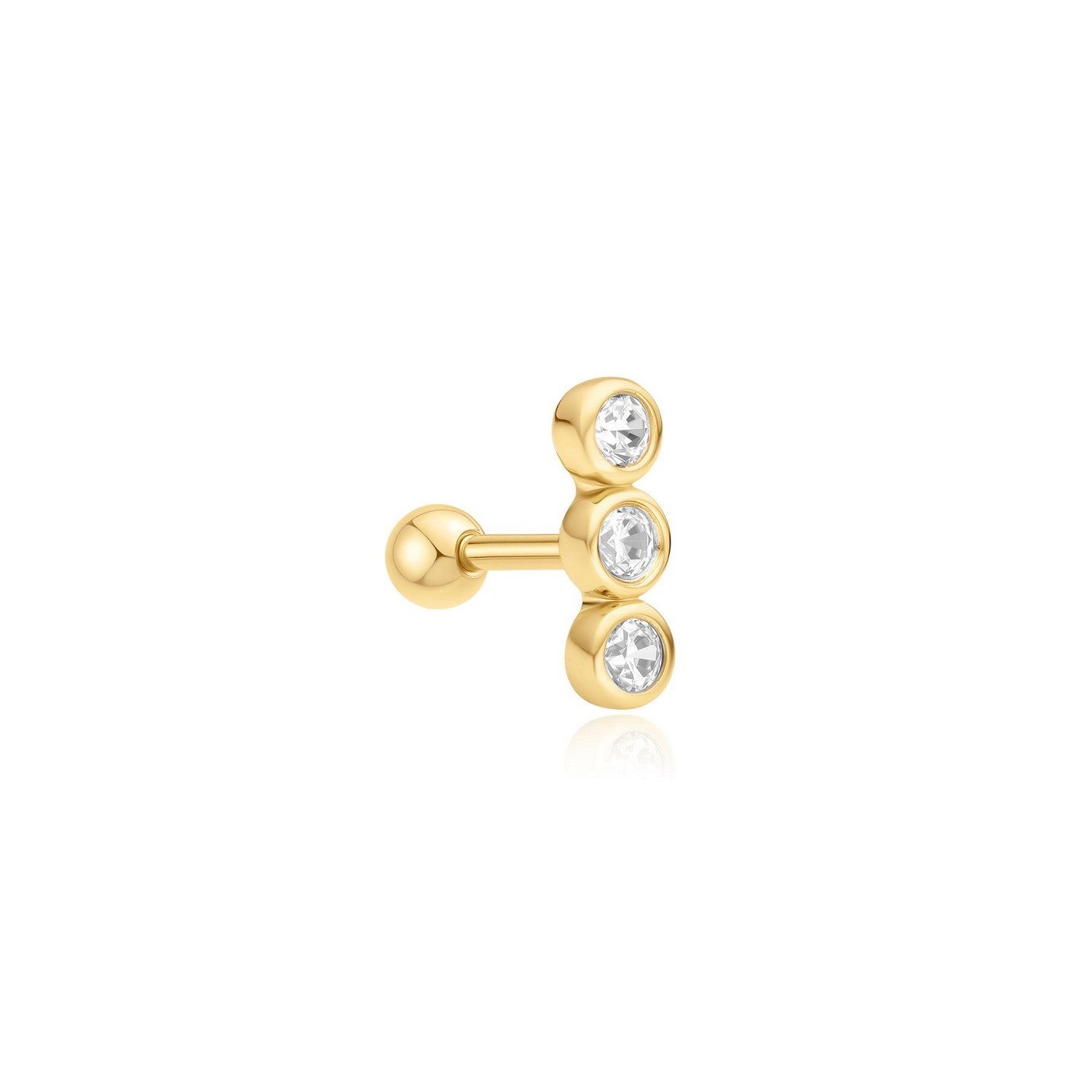 Gold earring with three clear gemstones on a white background