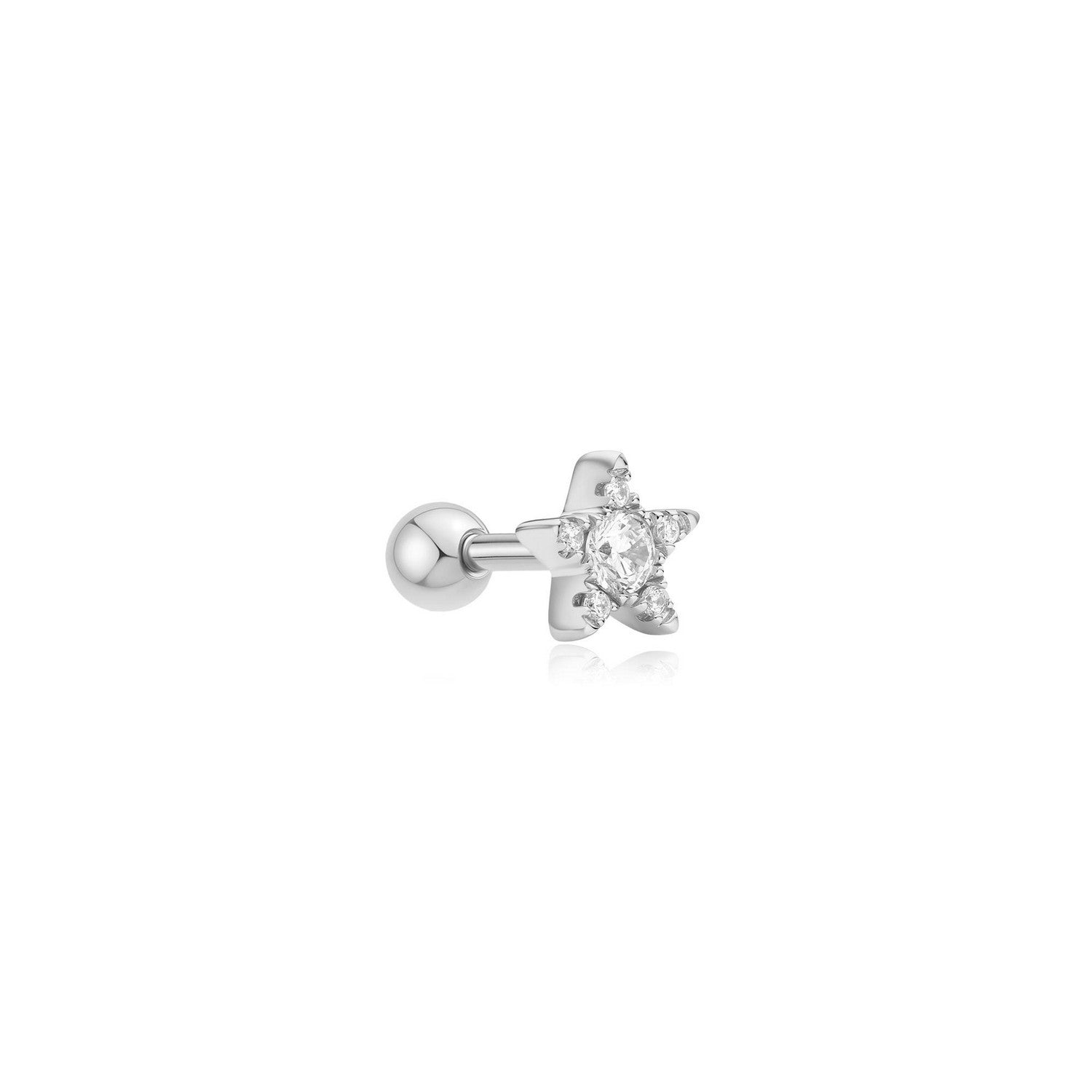 Star-shaped silver earring with a clear gemstone on a white background
