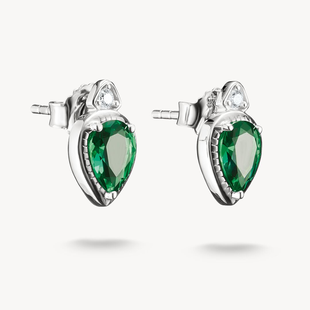 Pair of silver earrings with green gemstones on a white background