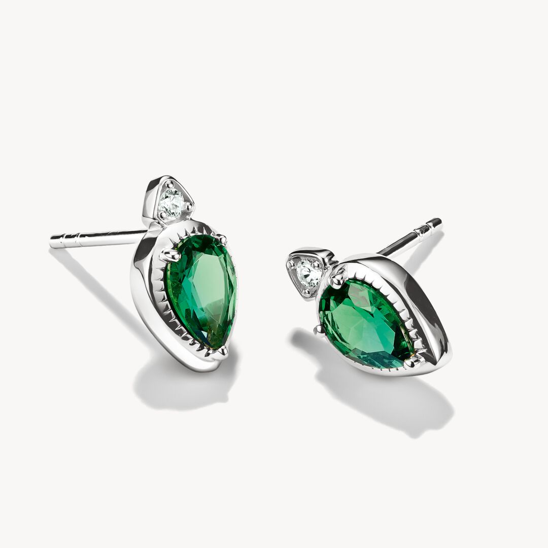 Pair of silver earrings with green gemstones on a white background
