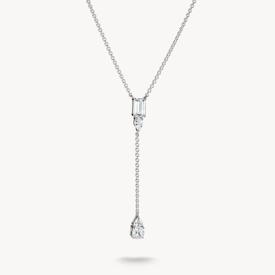 Diamond necklace with two pendants on a white background