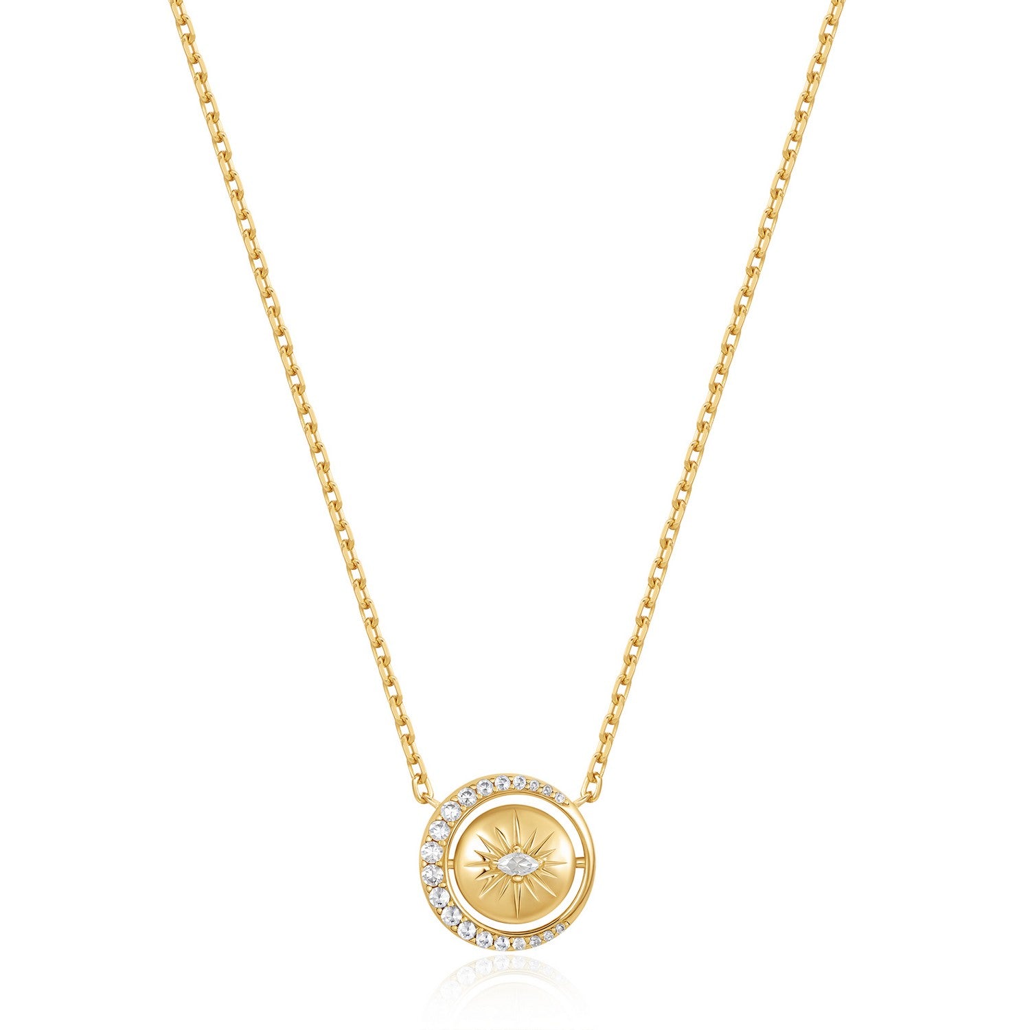 Gold necklace with a circular pendant on a white background