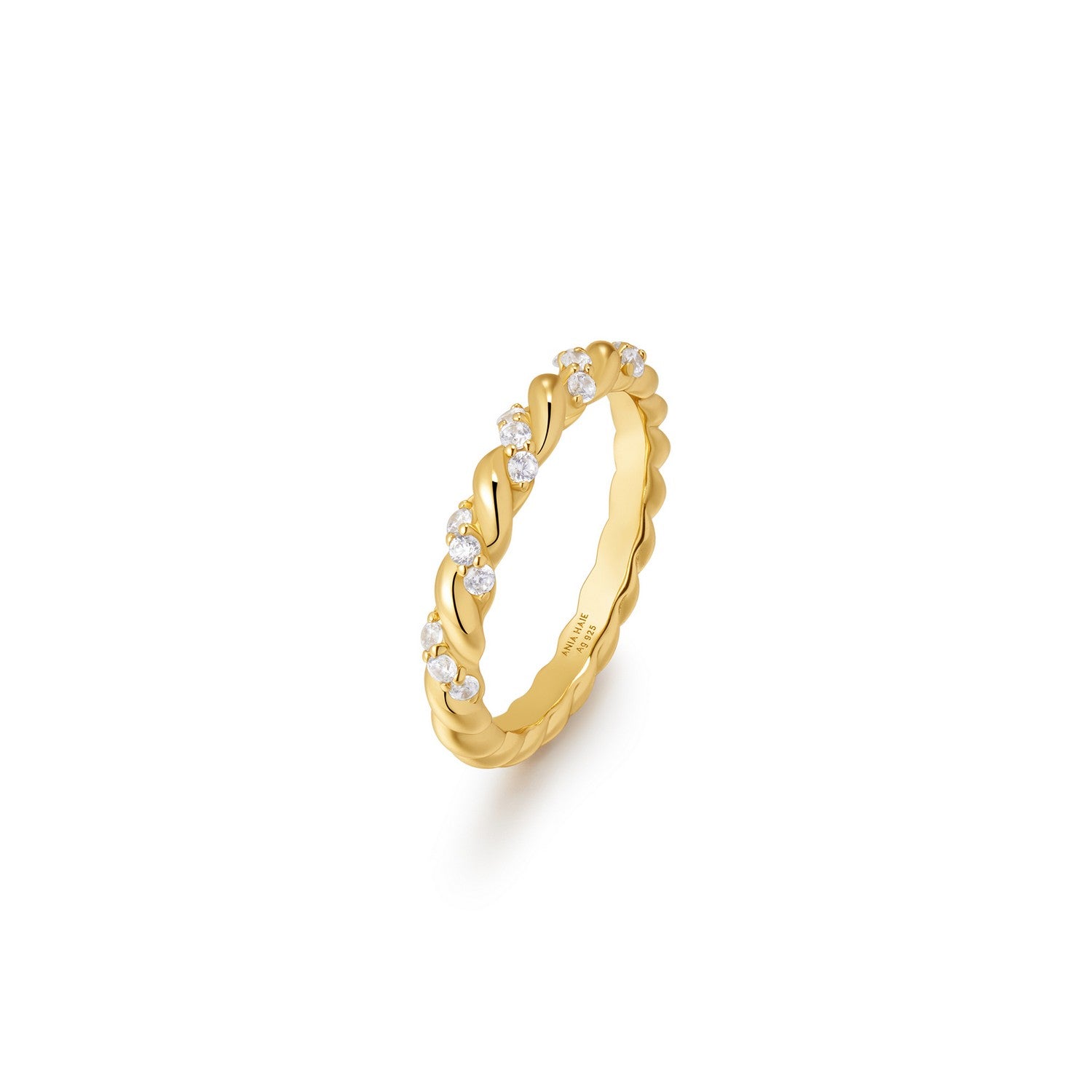Gold ring with small diamonds on a white background