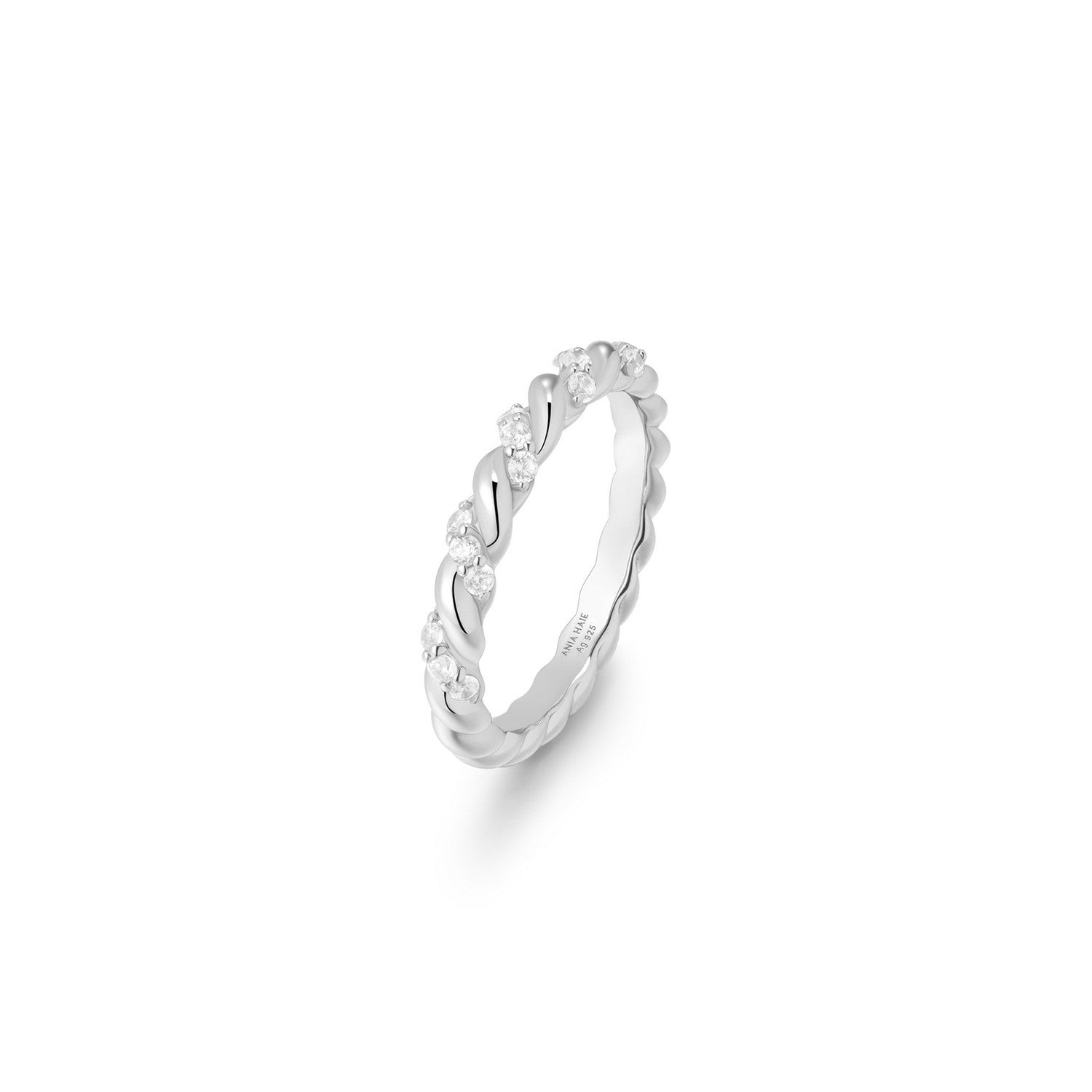 Silver ring with small stones on a white background