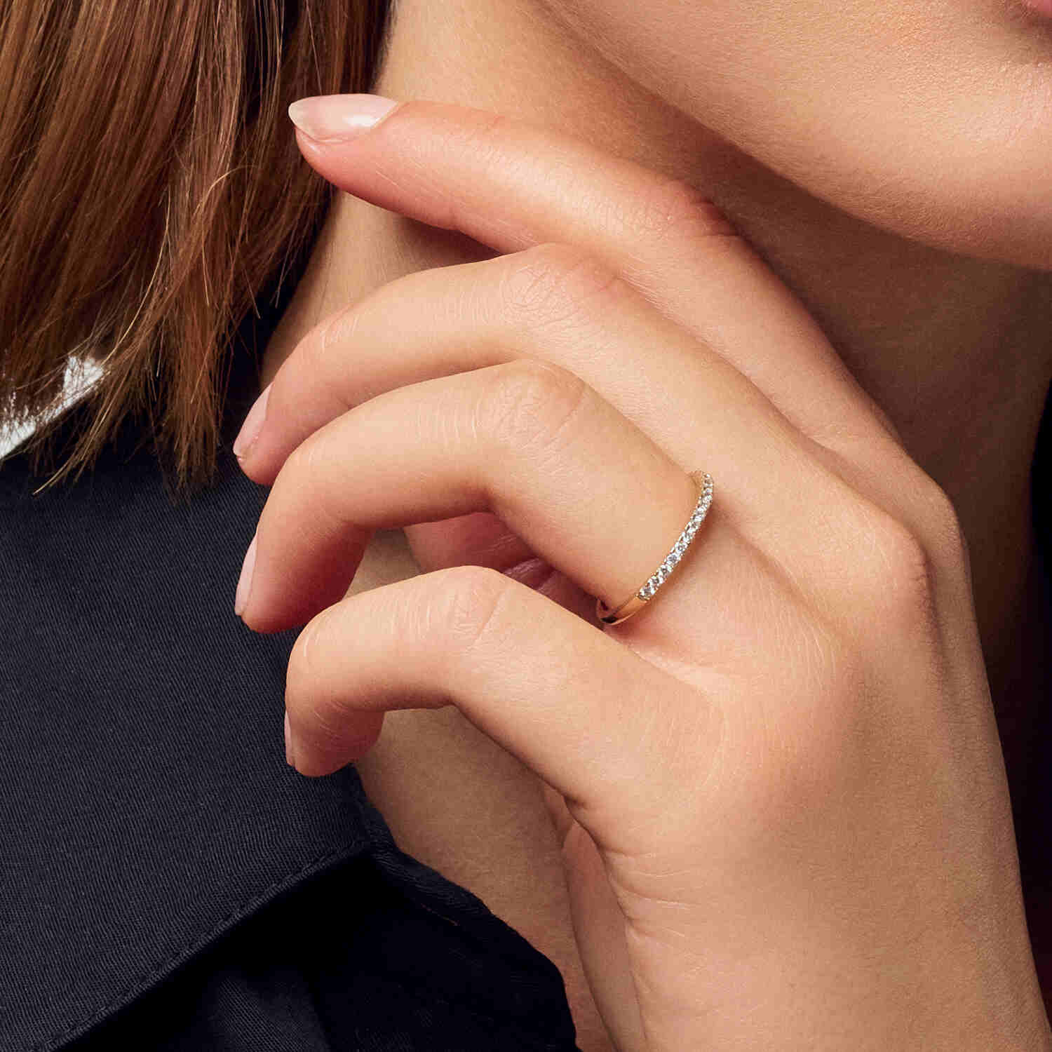 Stylish model showcasing the 14k White Gold Alba Diamond Ring SJ-R2515-WD-WG on her hand, illuminating the beauty of this exquisite ring with lab-grown diamonds.