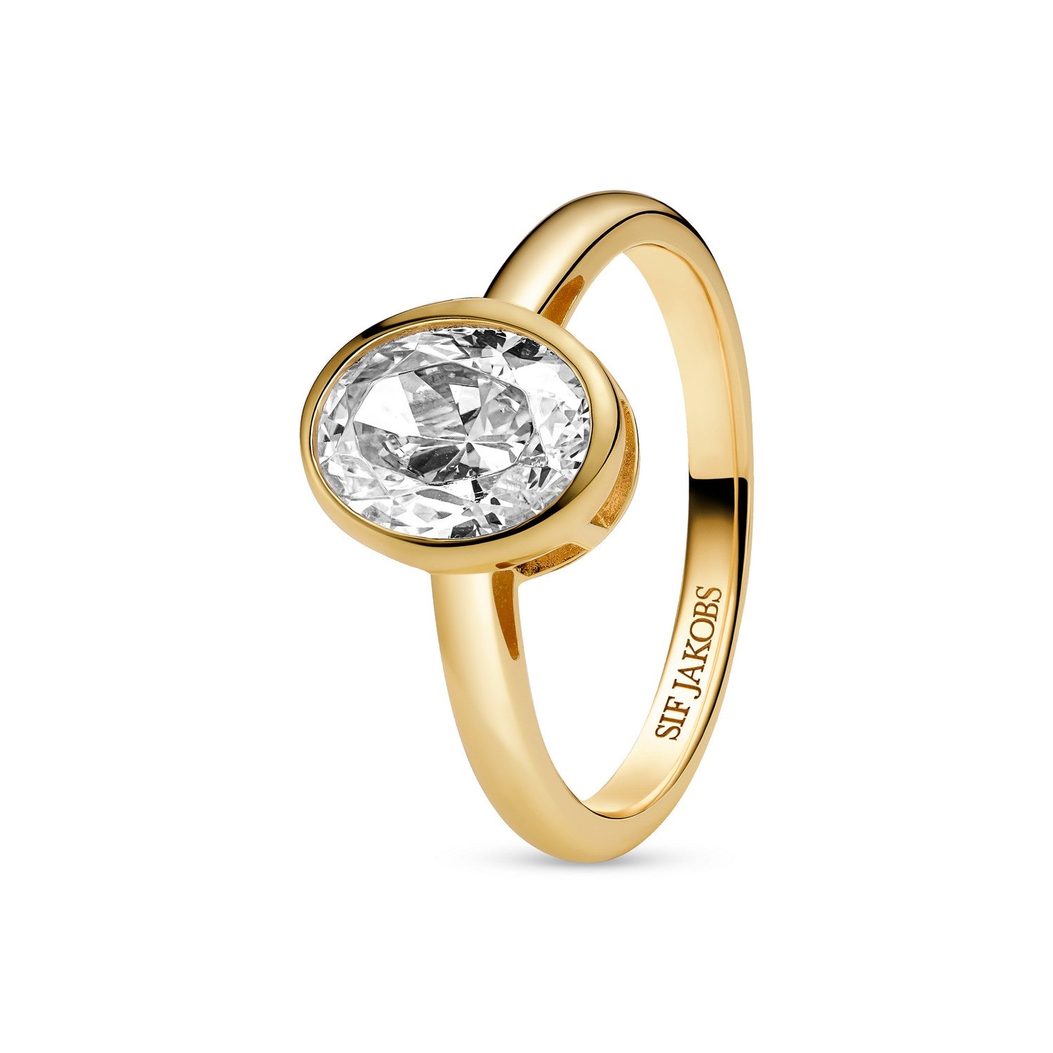 Gold ring with a clear gemstone on a white background