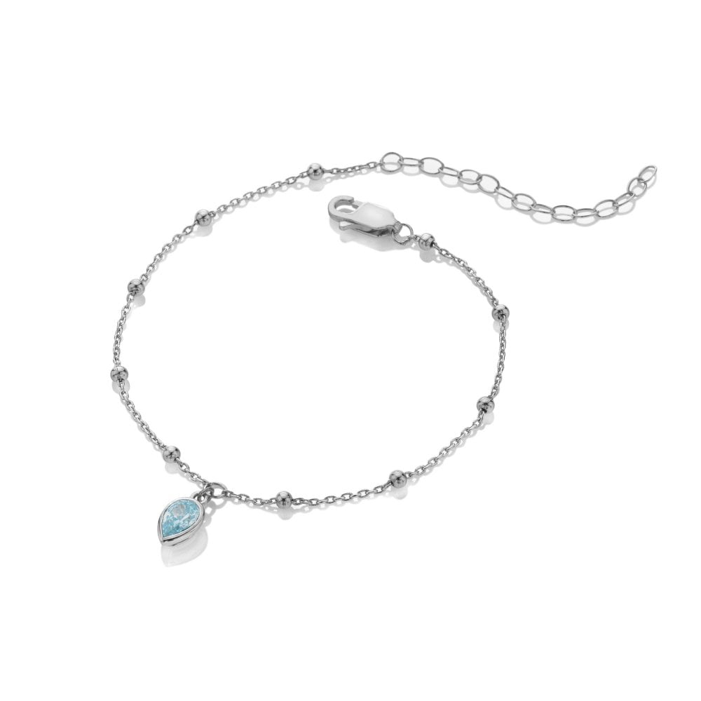 Silver bracelet with a heart-shaped blue gemstone charm