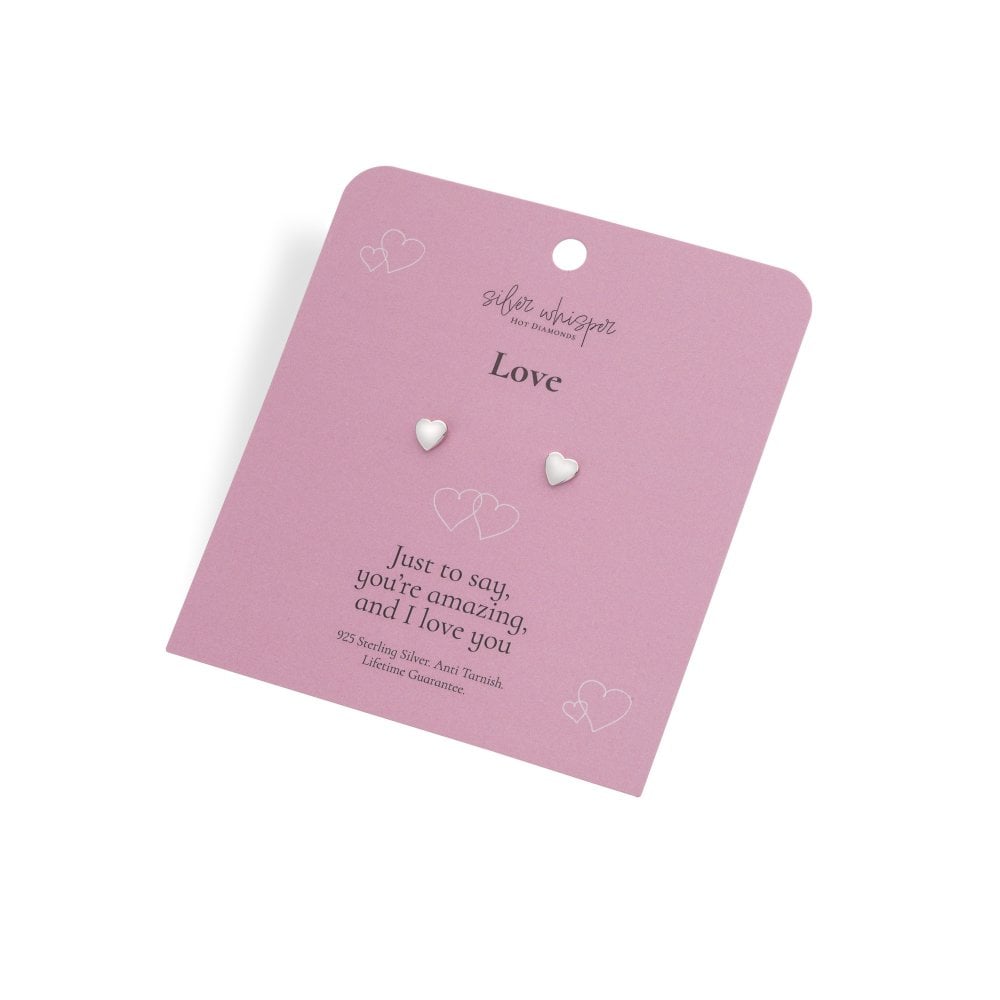 Heart-shaped earrings on a pink card with 'Suffie Wasserman' branding