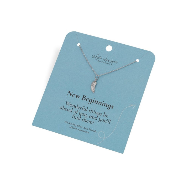 Necklace on a blue card with 'New Beginnings' message