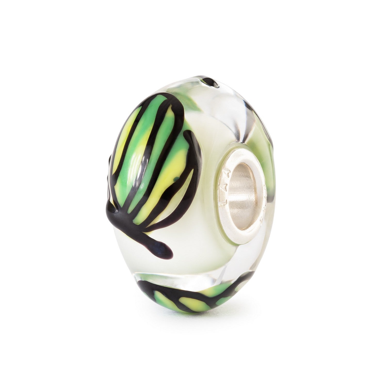 Glass charm bead with green and black swirl design on a white background
