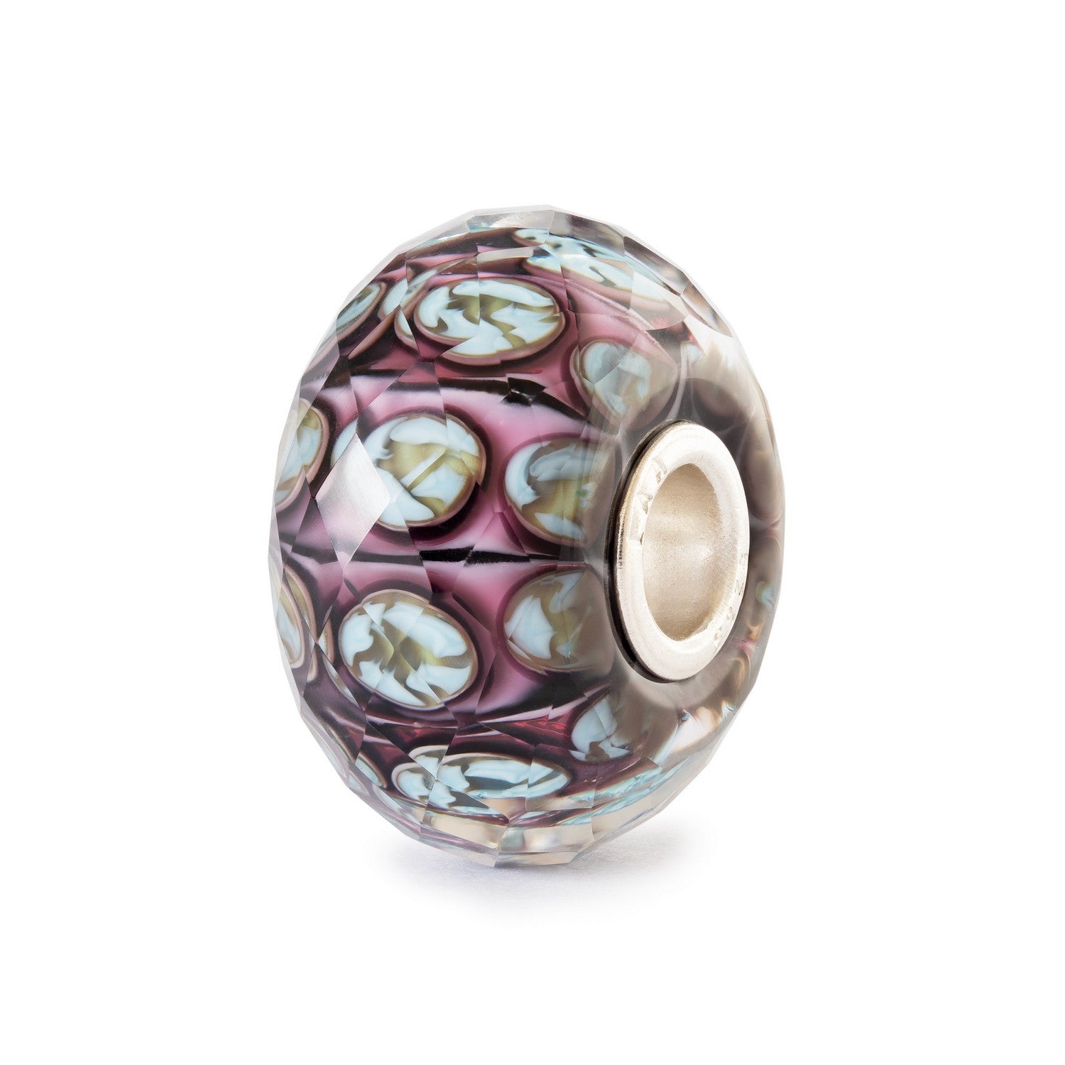 Decorative glass bead with intricate patterns on a white background