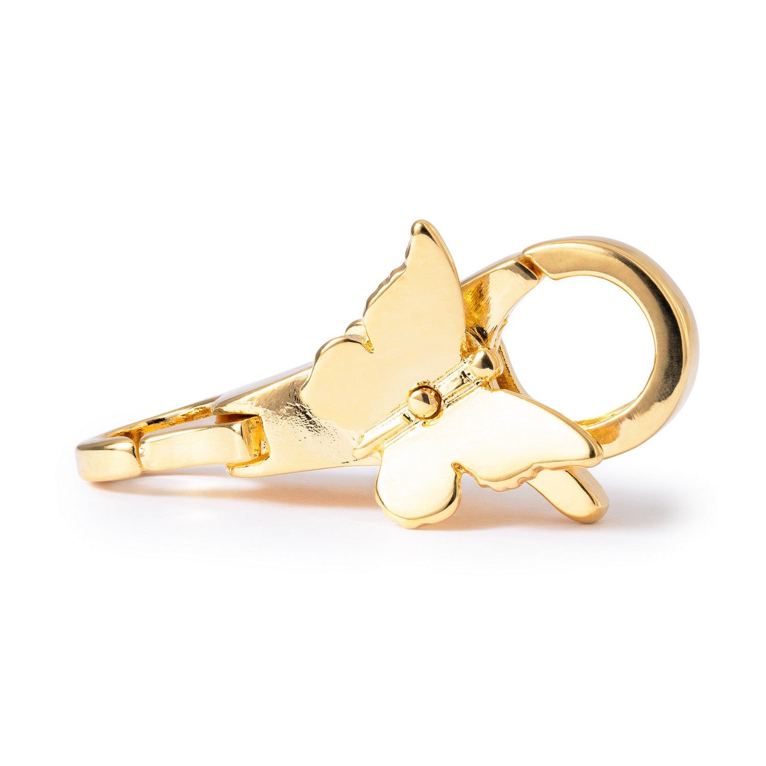 Gold butterfly ring on a white background