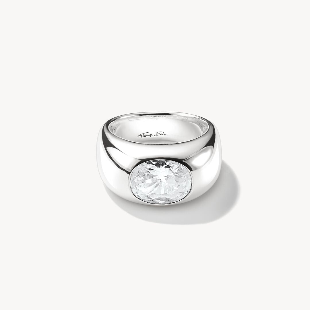 Silver ring with a clear gemstone on a white background