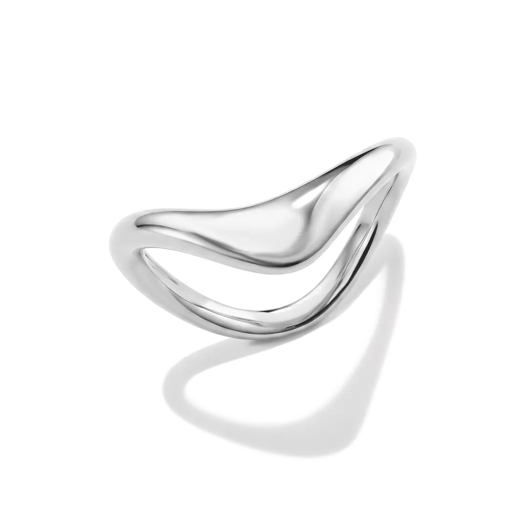 A polished silver ring with a fluid, wavy, open design, photographed on a clean white background with a soft shadow underneath.