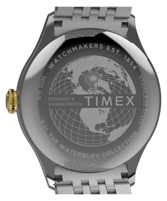Close-up of the back of a stainless steel Timex watch with a metal bracelet, showing engraved text and a globe design on a white background.