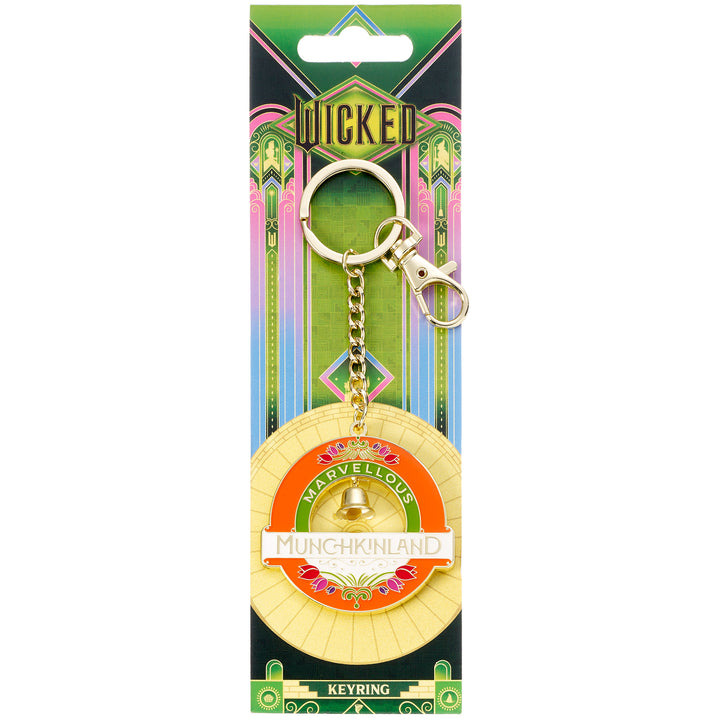 Keychain with 'Wicked' branding on a colorful packaging background