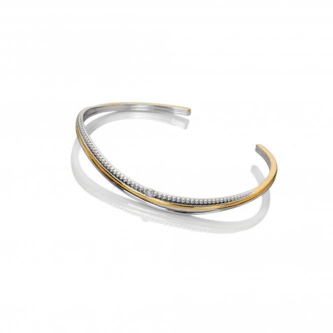 Two-toned silver and gold bracelet on a white background