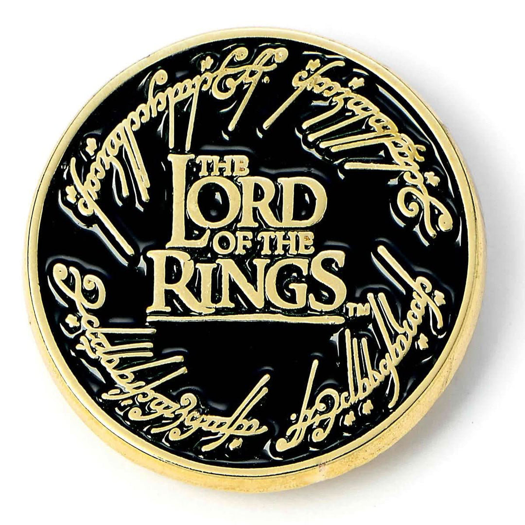 a gold and black coin with the words lord of the rings on it