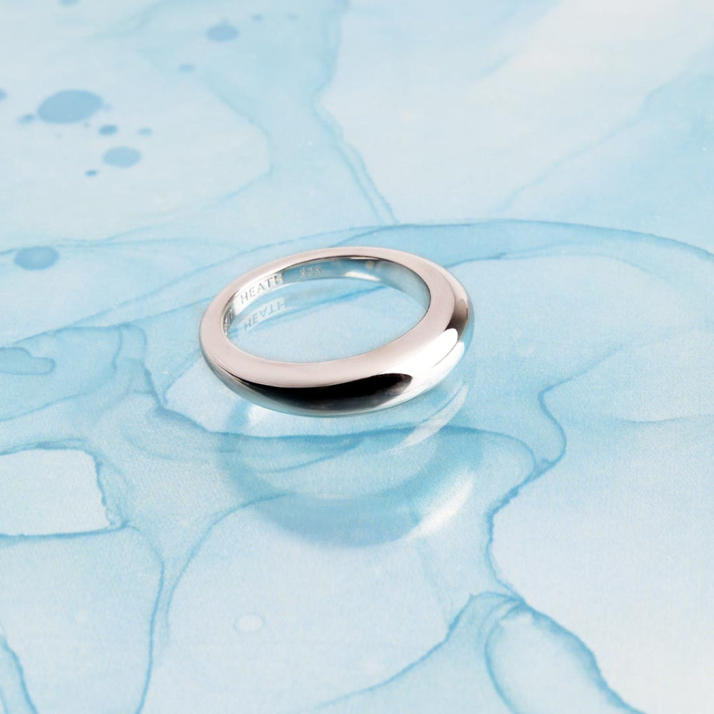 Silver ring on a blue marbled background