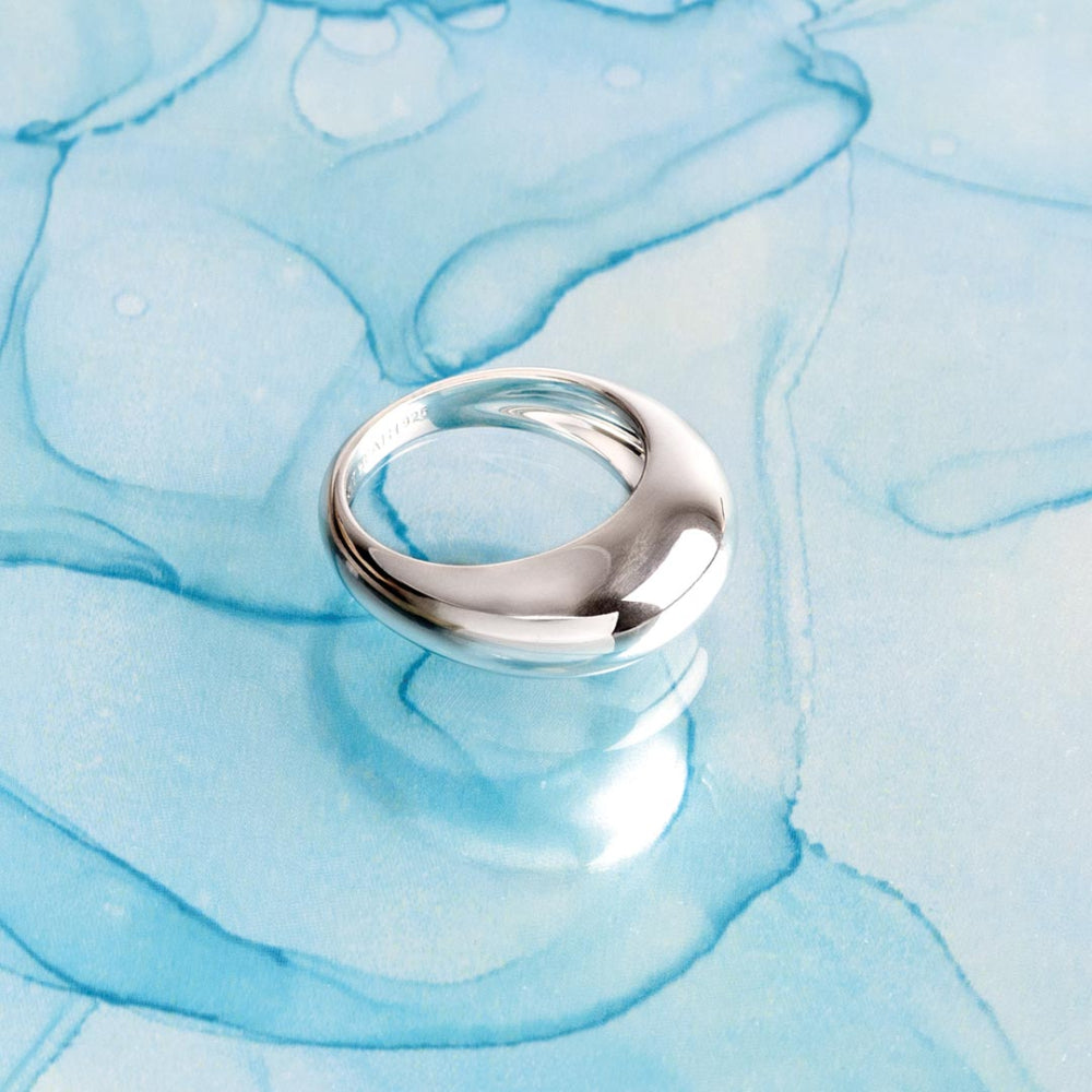 Silver ring on a blue marbled background