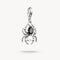 Jewelry pendant with black gemstone and pearl on a white background