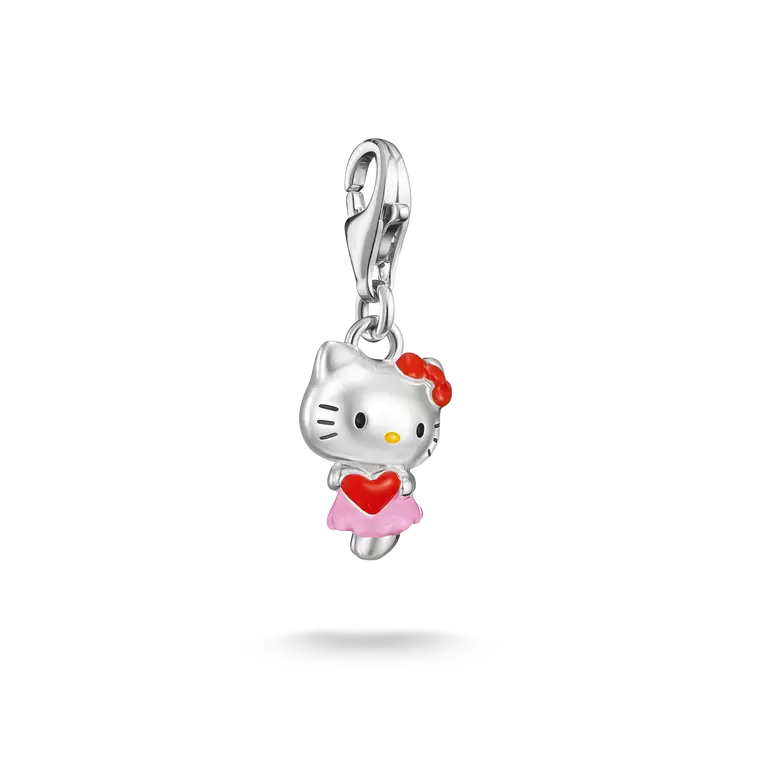 A silver Hello Kitty charm pendant featuring a silver cat head with a red bow, holding a red heart, wearing a pink skirt, and attached to a silver lobster clasp, shown on a white background with a soft shadow.