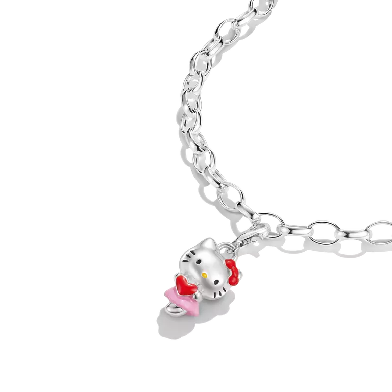A silver-toned link chain necklace featuring a Hello Kitty charm with a pink dress, red bow, and yellow bow tie, shown on a clean white background.