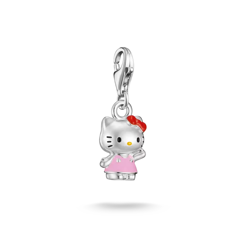 A silver Hello Kitty charm pendant featuring a silver body, pink dress, red bow, and yellow nose, suspended from a silver lobster clasp on a white background.