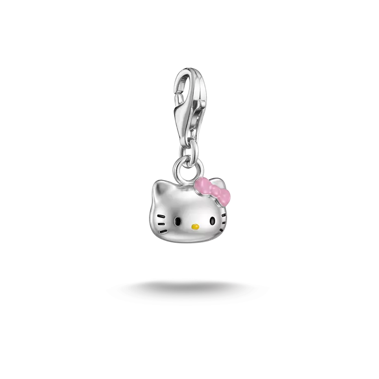 A silver Hello Kitty charm pendant with a pink bow and yellow nose, suspended against a plain white background.