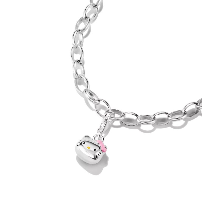 A silver link chain bracelet featuring a Hello Kitty face charm with a pink bow, shown on a clean white background.