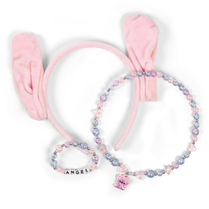 Pink headband with bow and beaded necklace on a white background
