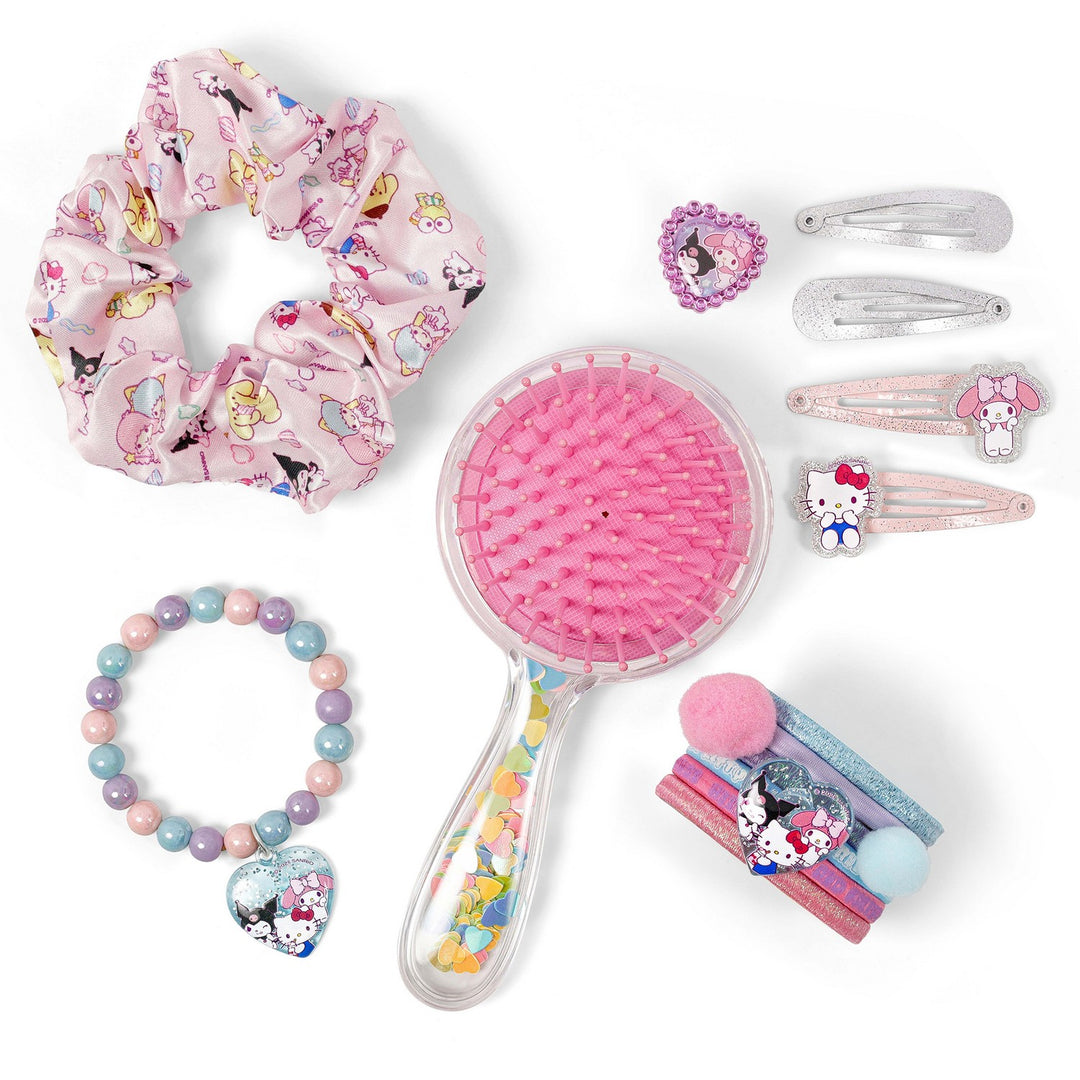 Set of children's hair care products including a scrunchie, brush, and hair accessories on a white background.